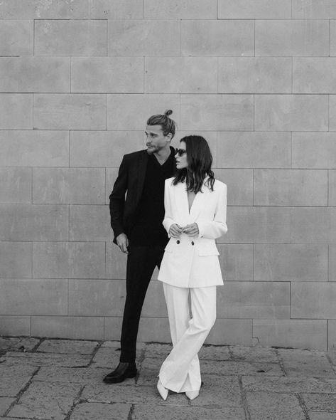 City Hall Groom Outfit, Pant Suit Engagement Photos, White Blazer Engagement Outfit, White Jumpsuit Engagement Photos, White Suit Engagement Photos, Black And White Couple Outfits, Non Traditional Groom Attire, Couple In Suits, Civil Marriage Outfit