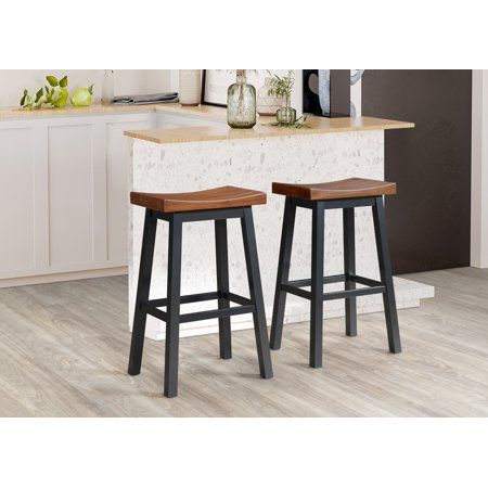 Put the finishing touches on a comfortable and inviting kitchen redesign with this modern farmhouse saddle barstool. Crafted in solid rubberwood for optimal performance, the stool boasts a curved saddle seat perfect for everything from a quick morning coffee to a relaxed evening in the kitchen. The backless design includes a built in footrest and its low-profile, backless design is ideal for compact spaces, easily tucking out of the way when not in use. Color: Brown. Farmhouse Bar Stools, Inviting Kitchen, Counter Stools Backless, White Bar Stools, Walnut Kitchen, Kitchen Redesign, Chair Options, Saddle Seat, Swivel Counter Stools