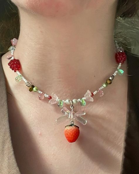 Sweet strawberries choker (adjustable) $35.00 Now available 🍓☘️🤍✨ #strawberry #strawberryshortcake #berry #berries #green #pink #pinkaesthetic #fairy #fairies #teardrop #teardrops #gemstones #gemstonejewelry #literature #dragons #dragon #greekmythology #beadsjewelry #cottagecore #fairycore #smallbusiness #smallbusinessowner #smallbusinesssupport #flowers #flower #flowerjewellery Strawberry Necklace, Deja Vu, Fairy Grunge, Handmade Bracelet, Fairy Core, Flower Jewellery, Strawberry Shortcake, Diy Beads, Pink Aesthetic