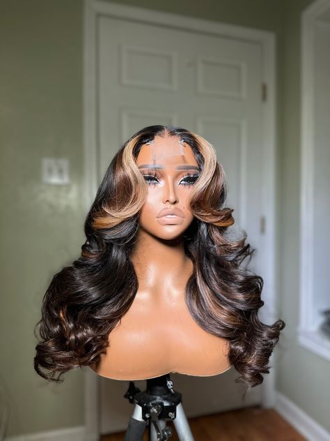 This is a GLUELESS PREMADE UNIT* All PRE ORDERED wigs take 10-15 business days to be completed. The standard shipping time is 2-3 days. All wigs come fully customized and ready to wear with combs and adjustable straps. All premade wigs come in standard sizes that fit 20in-23.5in head sizes. Wig Specs Style: layers Density: 200% Length: 20 Hair type: Virgin body wave Color: natural brown base with blonde and light brown highlights Lace: transparent 2x6 (can only be worn as a middle part) Style Layers, Light Brown Highlights, Frontal Wig Hairstyles, Peekaboo Hair, Cute Curly Hairstyles, Cute Box Braids Hairstyles, Pretty Hair Color, Natural Hair Styles Easy, Hair Affair