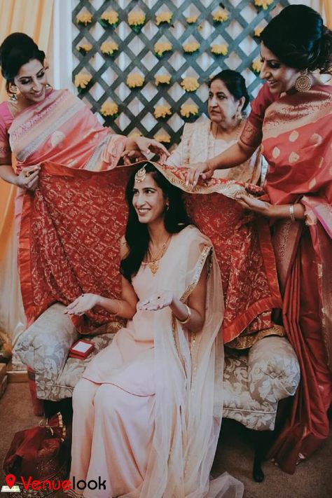 Chunni ceremony marks the official engagement of the to-be-weds. Usually, the family members of the groom visit the family of the bride with gifts. A red-colored outfit like a sari or a lehenga-choli has gifted a headscarf called chunni. Punjabi Chuni Ceremony, Punjabi Engagement Ceremony, Punjabi Chunni Ceremony, Chunni Ceremony Decor, Chunni Ceremony Outfit, Chunni Ceremony Gifts, Chunni Ceremony Punjabi, Indian Wedding Planning Checklist, Chunni Ceremony