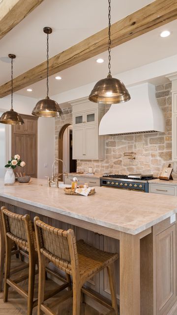 Davies Design Build on Instagram: "The kitchen in our 2023 @uvparade home was a fan favorite! We loved taking our clients vision and bringing it to life. Here are the details! -The stone we used is from @beehivebrickandstone and we used the Bonneville stone with white grout. -The cabinet color is SW Accessible Beige. #kitchendesign #cabinetdesign #designbuild #sketchup #utahbuilder #utahcustomhomebuilder #constructbuild #buildersofig #luxedesign #beautifulhome #interiorarchitecture #luxehome #dreamhome #utah #designbuild #construction #constructionlife #stone #realestate #design #interiordesign #finishcarpentry #lightingdesign #kitchenbacksplash #kitcheninspiration #kitchen" Decor Glass Jars, Barndo Kitchen, Green Country Kitchen, Kitchen Soffit, Backsplash Trends, Beige Cabinets, French Style Homes, Green Country, Stone Kitchen