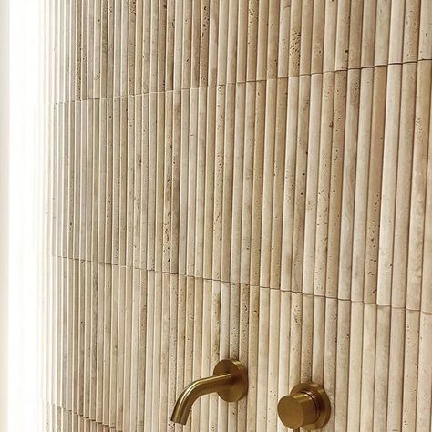 LUSSO on Instagram: "An emerging trend within interior design, fluted wall tiles create a timeless and dramatic feature element in homes. Inspired by classical ancient architecture of Greece and Rome, fluted tiles are designed with a fluted curve for a luxurious textured effect. Crafted with our exclusive travertine - a natural stone characterised by its unique organic texture and natural beauty. Style the Romano fluted tile in your bathroom, kitchen or as a feature wall. #Lusso #fluted #kitchentiles #flutedtile" Fluted Travertine Wall, Travertine Fluted Tile, Fluted Tile, Bathroom Attic, Fluted Wall, 3d Wall Tiles, Bathroom Design Decor, Wood Look Tile, Ancient Architecture