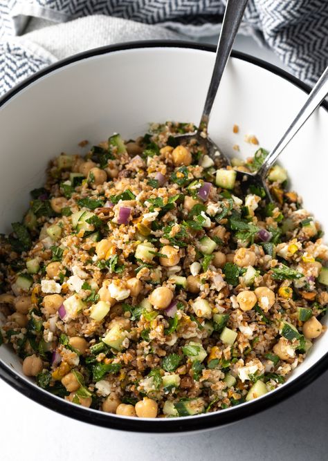 Large white bowl filled with bulgar wheat, veggies, and feta salad. Two metal salad spoons are in the bowl as well. Bulgar Salads, Wheat Salad Recipes, French Press Cocktails, Bulgar Wheat Salad, Jennifer Aniston Salad Recipe, Bulgur Wheat Recipes, Jennifer Aniston Salad, Aniston Salad, Tequila Recipes