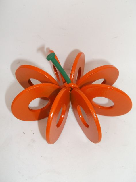 "Who would have thought that cute washers could turn into a pumpkin?   This Pumpkin is handcrafted using 8 small recycled 5/8 inch washers, and then painted orange along with a green stem. It makes a wonderful gift or the perfect piece for your home decor.  It is a great decoration all year round but, especially for Halloween.   SIZE: 4\" Width x 4\" Depth x 3\" Height. Dimensions are approximate and may differ slightly. HANDMADE IN THE USA When looking at the prices of these items please take i Scrap Metal Sculpture Junk Art, Halloween Welding Projects, Metal Pumpkins Decor, Halloween Metal Art, Metal Projects That Sell, Scrap Metal Projects, Horseshoe Welding, Ag Mechanics, Moose Crafts