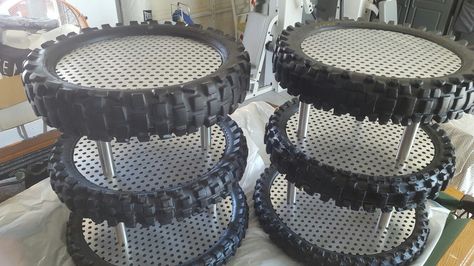 Recycled some used dirt bike tires to make these tiered cake stands Motorcycle Themed Birthday Party For Men, Dirtbike Party Ideas, Dirt Bike Birthday Party Ideas, Dirt Bike Wedding Ideas, Motocross Birthday, Dirt Bike Cupcakes, Atv Party Ideas, Dirt Bike Party Ideas, Dirt Bike 3rd Birthday Party