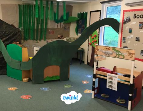 🦕 This dinosaur museum role play area is a great addition to any learning environment. Complete with museum stand, dinosaur number footprints, a huge dinosaur and sensory area - we love it. Click to download everything you need to create your own dinosaur area with our museum role play pack. #dinosaur #dinosaurs #roleplay #display #readingarea #readingcorner #museum #play #children #numbers #teaching #teach #teacher #parents #twinkl #twinklresources Dinosaurs Eyfs, Dino Museum, Sensory Area, Walker Learning, Dinosaur Ideas, Dinosaur Classroom, Dinosaur Activities Preschool, Dramatic Play Themes, Dinosaur Museum