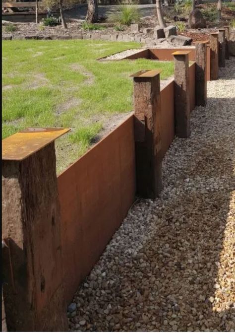 Corten retaining wall panels between sleepers Corten Retaining Wall, Corten Fence, Corten Steel Retaining Wall, Corten Steel Fence, Garden Boundary, Fence Gardening, Concrete Sleeper Retaining Walls, Wooden Retaining Wall, Pool Retaining Wall