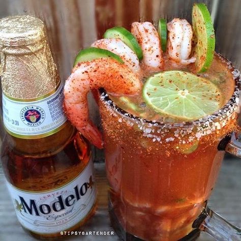 CEVICHE MICHELADA  Modelo Beer Camaronazo Juice  Lime Juice  Lemon Juice  Bitters  Tapatio Hot Sauce (Ceviche) shrimp , cucumber , avocado , cilantro , cherry tomatoes  Instagram Photo Credit: @calimixers  Videos: www.youtube.com/TipsyBartender Pictures: www.Instagram.com/TipsyBartender Snapchat: TipsyBartender  www.twitter.com/TipsyBartender  www.pinterest.com/TipsyBartender  #beer #michelada #cocktail #drink #summer Beer Shrimp, Ceviche Shrimp, Michelada Recipe, Modelo Beer, Guatemalan Recipes, Mexican Snacks, Mexican Drinks, Shrimp Ceviche, Beer Store