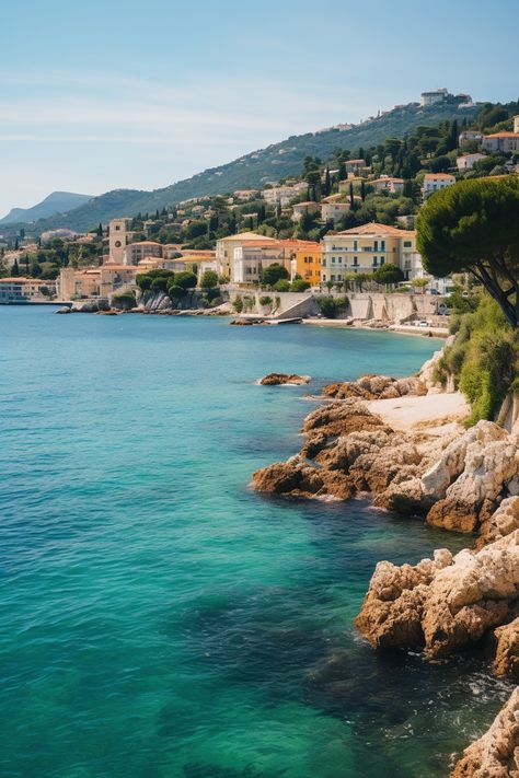 An idyllic view of a village nestled by the coastline in the charming French Riviera French Seaside, Tranquil Retreat, The French Riviera, Cote D’azur, Coastal Towns, French Riviera, Lush, Sun, France