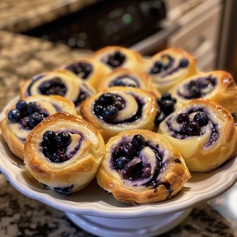 🍰 Dive into dessert for breakfast with our Blueberry Cheesecake Rolls! Sweet, creamy, and bursting with berries. #MorningDelight 🍽️ Blueberry Cheesecake Rolls 🛒 Ingredients: 1 can crescent rolls 1 cup cream cheese, softened 1/2 cup blueberries 1/4 cup sugar 1 tsp vanilla extract 1 tbsp lemon zest 👩‍🍳 Instructions: Prepare: Unroll crescent dough, flatten. Mix: Combine cream cheese, sugar, vanilla, and lemon zest. Assemble: Spread cream cheese mixture on dough, sprinkle with blueberries, ro... Blueberry Cheesecake Rolls, Blueberry Croissant, Cheesecake Rolls, Crescent Roll Casserole, Crescent Roll Cheesecake, Dessert For Breakfast, Instagram Recipes, Twisted Recipes, Dessert Tea