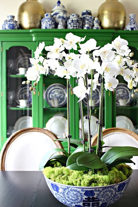 Chinoiserie Bowl Centerpiece, Bowl Centerpiece Ideas Dining Rooms, Orchid In Bowl, Orchids In Blue And White Bowl, How To Make Faux Orchid Arrangement, Fake Orchid Arrangements, Flower Arrangements In Bowl, Orchid Bowl Centerpiece, Faux Orchid Arrangements Diy