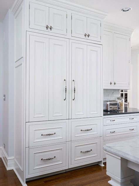 Concealed beneath cabinetry panels, the fridge-freezer combo blends effortlessly with the kitchen's traditional-style cabinets. Toe Kick Ideas, Land House, Kitchen 2023, Kitchen French, Kitchen Traditional, Wall Moulding, Refrigerator Cabinet, Ultimate Kitchen, Cabinet Fronts