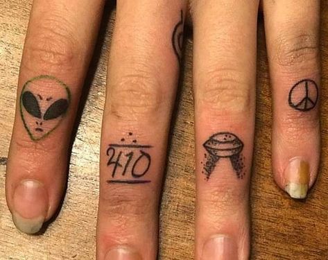 Micro Finger Tattoos done by Ellie Mac Ink in Roy, Utah. Includes alien, 410, spaceship and peace symbol. Space Themed Finger Tattoos, Alien Tattoo Finger, Alien Finger Tattoo, 410 Tattoo, Peace Tattoos, Ellie And Mac, Knuckle Tattoos, 13 Tattoos, Alien Tattoo