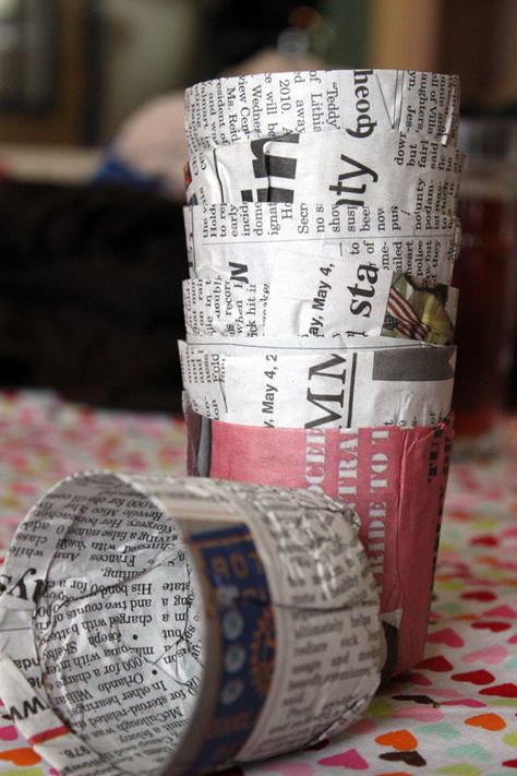 newspaper seeding pots. I used the edge of a ruler to tear the newspaper along. I couldn't get the bottoms of the pots to stay folded so ended up using a small piece of sticky tape. Now to see how long   they hold up to damp seed mix. Farm Plants, Seed Starters, Gardening Tricks, Paper Pot, Seedling Pots, Seed Pots, Gardening Projects, Starting Seeds Indoors, Hydroponic Growing