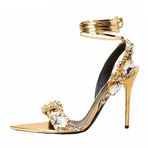 PRICES MAY VARY. Made of metallic patent leather, these gold heels for women are encrusted with sparkling crystals, which will add instant sparkle to any outfit. Sit atop a 4.33 inches high stiletto heel, get ready to show off your sassy side with these women’s stiletto high heel sandals. The insole is covered with smooth PU leather, with lightweight and slip-resistant rubber sole, these stilettos will allow you to take a comfy step outside. Highlights: Gold-tone, metallic sheen, decorative crys Curated Fashion, High Heels For Prom, Heels Prom, Rhinestone High Heels, Jeweled Sandals, Strappy Stilettos, Open Toe High Heels, Studded Heels, Metallic Sandals