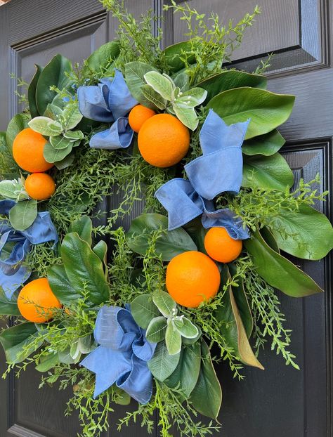 This is it… the perfect wreath for any season! Vibrant oranges, two kinds of magnolia leaves, herbs, and pittosporum leaves are a fresh, fabulous combination. French blue dupioni silk ribbons are the perfect finishing touch to give it the signature Grace Harris Collection look! Make it yours! This wreath is shown in 24” and 30” sizes. Shown with optional wreath sashes and bows sold separately. • Made to order, please allow 5-7 days processing time Each wreath and bow in the shop is handmade with Making Fall Wreaths, Orange Wreath, Magnolia Wreath, Magnolia Leaves, Dupioni Silk, Magical Garden, French Blue, Vibrant Orange, Fall Wreaths