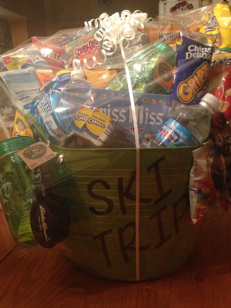 Gift basket I made for the ski team fundraiser Hockey Raffle Basket, Ski Basket Gift Ideas, Ice Fishing Gifts Basket, Ski Trip Gift Basket, Sports Themed Baskets Silent Auction, Yeti Cooler Basket Arrengmentw, Fundraiser Baskets, Team Fundraiser, Raffle Basket