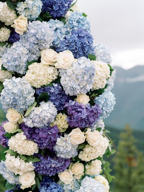 Blue Purple Hydrangea Wedding, Lavender Blue And White Bouquet, Purple And Blue Summer Wedding, Blue Purple And Ivory Wedding, Navy Blue And Lavender Wedding Centerpieces, White Blue And Purple Wedding, Blue And Purple Flower Arrangements Wedding, Wedding Decorations Hydrangea, Periwinkle Flower Arrangements