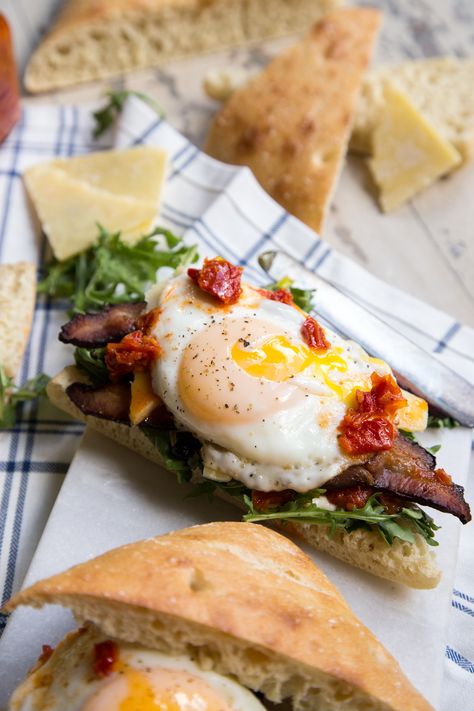 Bacon Egg and Arugula Breakfast Sandwich on Focaccia Bread Arugula Breakfast, Sandwich With Arugula, Bank Proof, Farmhouse Cooking, Arugula Recipes, Sandwich Ideas, Bacon Egg And Cheese, Ciabatta Bread, Egg Dishes