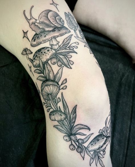 Mushrooms Around Knee Tattoo, Heart Shaped Mushroom Tattoo, Fairy Mushrooms Tattoo, Rose And Mushroom Tattoo, Mushroom Wreath Tattoo, Knee Tattoo Mushroom, Mushroom And Vines Tattoo, Snail With Mushroom Tattoo, Mushroom Fairy Circle Tattoo