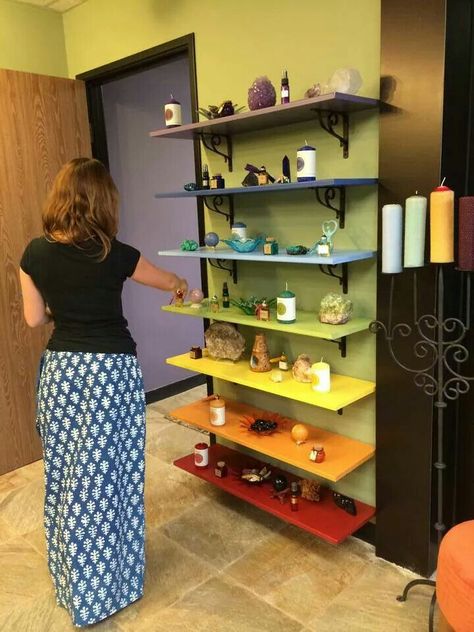 Chakra shelves. Love the idea, though I'd use much smaller shelves I think. Healing Space Ideas, Energy Healing Room Decor, Reiki Office Ideas, Reiki Studio Ideas, Chakra Shelf, Bed Facing Door, Chakra Shelves, Meditation Room Decor Ideas, Chakra Room Decor