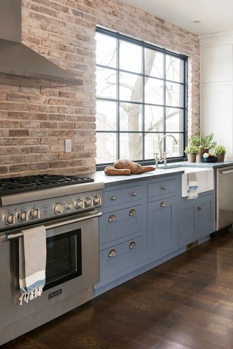 famhouse kitchen with brick wall | use arrow keys to view more kitchens swipe photo to view more kitchens Kitchen With Brick Wall, Brick Wall Kitchen, Backsplash For White Cabinets, Trendy Farmhouse Kitchen, Farmhouse Kitchen Backsplash, Trendy Kitchen Colors, Brick Kitchen, Brick Backsplash, Blue Cabinets