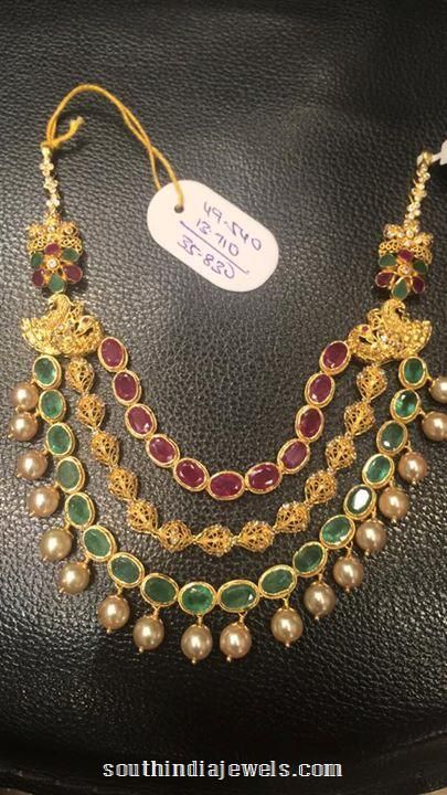 22k gold multi layer ruby emerald necklace design from Premraj Shantilal Jain Jewellers. Neck Pieces Jewelry, Gold Jewelry Simple Necklace, Beautiful Gold Necklaces, Antique Bridal Jewelry, Gold Necklace Indian Bridal Jewelry, Gold Necklace Simple, Black Beaded Jewelry, Gold Pendant Jewelry, Real Gold Jewelry