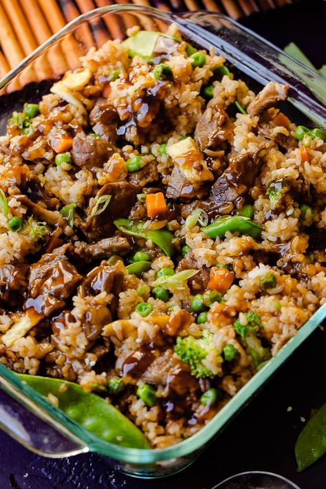 Our VIRAL recipe for Teriyaki Chicken Casserole still goes crazy on our site every single month, but don't we need a Teriyaki Beef Casserole too?! Fried rice tossed with bright veggies and saucy teriyaki beef! #beef #casserole #teriyakibeef #teriyaki #beefdinner #beefrecipe #casserolerecipe #easyrecipe #easydinnerrecipe #dinnerrecipe Teriyaki Beef Casserole, Teriyaki Casserole, Recipe For Teriyaki Chicken, Beef Fried Rice Recipe, Steak Veggies, Teriyaki Chicken Casserole, Beef Teriyaki, Beef Fried Rice, Easy Teriyaki Chicken