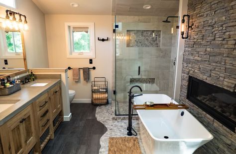 How To Design The Most Charming Rustic Bathroom Primary Bathrooms, Rustic Remodel, Rustic Bathroom Remodel, Two Sided Fireplace, Ceramic Tile Bathrooms, Adobe Home, Bathroom Fireplace, Rustic Bathroom Designs, Bathroom Tub