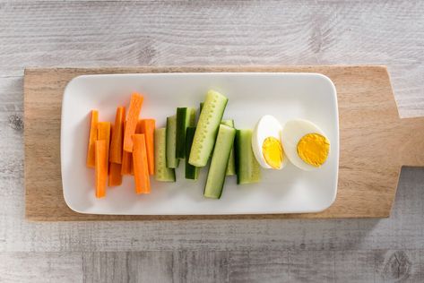 Egg & Veg Combo   Method: Boil an egg for 10 minutes until cooked, then shell the egg and slice in half. Peel a carrot and slice into sticks. Slice cucumber into sticks also. Place all ingredients onto a plate and enjoy.   Ingredients: 1 egg 1 carrot 1 lebanese cucumber Vegetable Sticks, 1 Egg, Boiled Eggs, Cucumber, Carrots, 10 Things