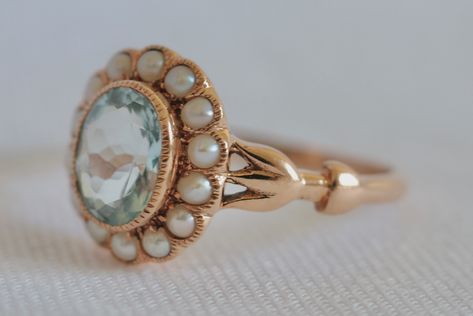 A 9k solid gold Georgian style seed pearl and aquamarine ring. Not sure if centre stone is an aquamarine or a topaz, however it looks like it is an aquamarine. The centre stone is beautifully faceted. It is a size 7 1/4 and weighs 2.24g. The condition of this item is used and in very good condition. Price: $520AUD Free standard post is offered however insurance is an additional. All sales are final. Inspection is highly recommended and additional photos/videos can be provided upon request. ... Georgian Ring Engagement, Chunky Silver Rings Georgian, Georgian Jewelry 18th Century, Georgian Rings Antique, Georgian Ring, Aquamarine Ring, Seed Pearl, Aquamarine Rings, Multi Stone