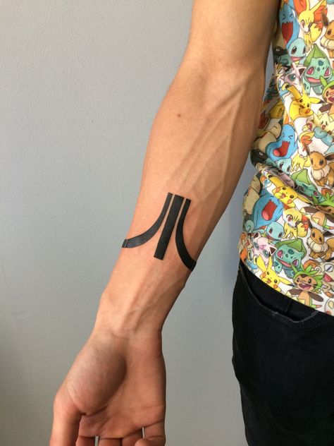 Bracelet-sryle Atari logo tattoo. Goes around the wrist. Atari Tattoo, Gamer Tattoos, Symbol Tattoo, Tattoo Bracelet, Symbol Tattoos, Art Tattoos, Symbolic Tattoos, Atari Logo, Body Art Tattoos