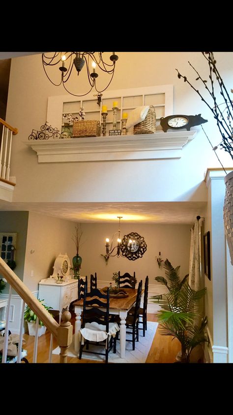 Repurposed door and mantle shelf placed on wall in two-story foyer above dining room. Loving the Farmhouse inspiration. Living Room High Ceilings, Tall Wall Decor, Ledge Decor, Mantle Shelf, Doors Repurposed, Foyer Decor, Farmhouse Inspiration, Foyer Decorating, Foyer Design