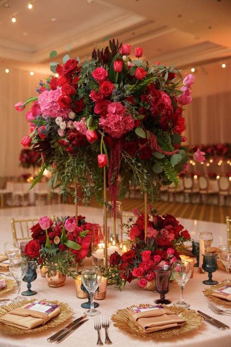 Romantic, floral centerpiece - tall, red and pink centerpieces with roses, tulips and greenery - Find your florist on WeddingWire! {Vanessa Jaimes Floral Design} Shades Of Pink Floral Centerpiece, Pinks And Burgundy Wedding, Pink Red Floral Arrangement, Wedding Centerpieces Red Roses, Blush Pink Red And White Wedding, White Pink Red Wedding, Red Roses Reception Decor, Pink Red Wedding Decor, Pink And Red Flowers Wedding