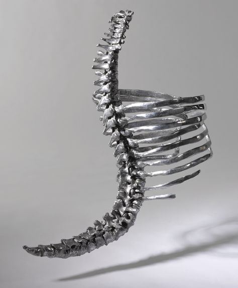 Skeleton Corset, Shaun Leane Polished aluminum with black leather neck and waist straps, hinged ribcage sections, length 25 inches. Created for Alexander McQueen's 'Untitled' Collection, Spring/Summer 1998. Savage Beauty, Metropolitan Museum of Art, 2011 and Victoria & Albert Museum, 2015. Photographed by Tim Walker for British Vogue, March 2015.  Anglomania, Tradition & Transgression in British Fashion, Metropolitan Museum of Art, 3 May - 4 September, 2006.  ‘Lee said he knew what he wanted for Skeleton Corset, Skeleton Structure, Skeleton Fashion, Claw Earrings, Shaun Leane, Philip Treacy, Body Adornment, Jewelry Auction, Fantasias Halloween