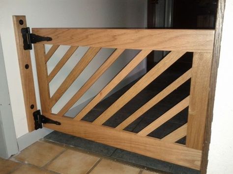 DIY Dog Gate: we need something that fits 64". I could do something similar to this, but have two gates that close in the middle instead of just one giant gate. DIY project for later. Diy Dog Gate, Industrial Basement, Diy Dog Crate, Wooden Gate, Stair Gate, Dog Stairs, Basement Renovation, Baby Gates, Dog Tips