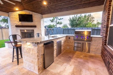 I like this one a lot. The brick/stone choice, the countertop, and the choice of appliances. Not a huge fan of the overlay tile color, but the shape / style is good. It might be the lighting, but the fireplace stone looks a bit whiter, and I prefer it slightly over the kitchen stone. Outdoor Kitchen Added To Patio, Covered Patio With Outdoor Kitchen Farmhouse, Outdoor Kitchen Back Porch, Covered Patio And Pool Ideas Layout, Small Outdoor Kitchen With Fireplace, Outdoor Kitchen Design With Fireplace, Outdoor Covered Patio With Fireplace And Kitchen, Grilling Porch Covered, Outdoor Patio Connected To House