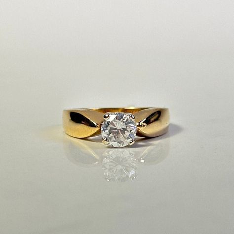 Elegant reverse tapered solitaire diamond engagement ring.  Round cut solitaire diamond, four prong secure and basket setting.  Stamped 14K yellow gold band, cathedral trellis setting with four prong secure. Colour H Clarity I-1 Cut Good Total weight of diamond = 0.75ct Total weight of ring = 4.25gr Ring size = 5.5 Item appraised at $6215 **FREE shipping within Canada and USA** If you have any questions or concerns, please do not hesitate to contact us. We will be more than happy to help you and Thick Yellow Gold Engagement Ring, Thick Gold Band Engagement Ring Vintage, Vintage Round Diamond Ring, Wide Band Engagement Ring Gold, Reverse Tapered Engagement Ring, Thick Band Engagement Ring Gold, Engagement Ring Thick Band, Thick Band Engagement Ring, Tapered Engagement Ring