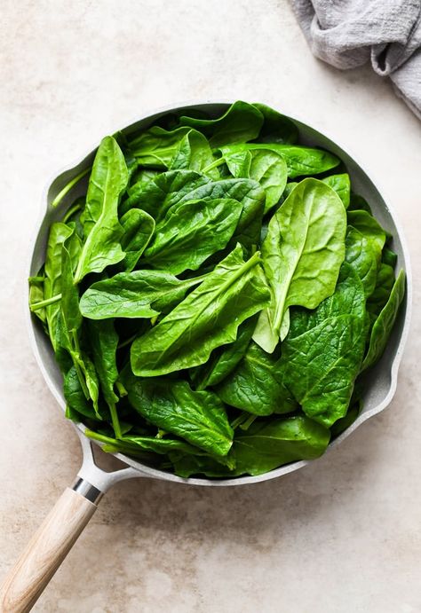 This 5 ingredient sautéed spinach with garlic recipe is a super easy side dish that is made in a skillet in just 10 minutes! It pairs beautifully with many different types of meals, from pan seared chicken to oven roasted fish. A simple back pocket veggie recipe that's perfect for any night of the week! Roasted Fish, Spinach Benefits, Veggie Recipe, Roast Fish, Paleo Sides, Garlic Recipe, Seared Chicken, Pan Seared Chicken, Easy Side Dish