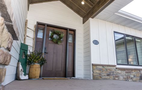 Board And Batten Siding With Stone, Board And Batten Siding With Brick, White Siding With Stone, Fairytale Farmhouse, White Board And Batten Exterior, Diamond Kote Siding, Board Batten Siding, Exterior Farmhouse, White Exterior Paint