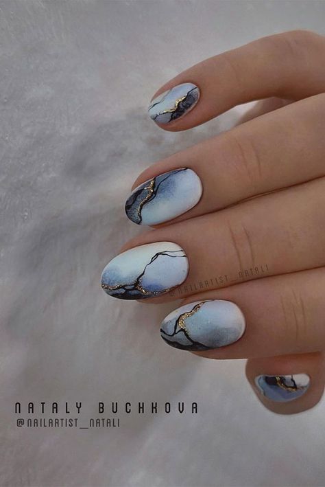 26. Blue and grey nails with marble gold Looking for a unique and creative design? If you are, then you need to see this... White Silver And Blue Nails, Navy Blue Marble Nails, Gray Marble Nails, Blue And Grey Nails, Chaotic Nails, Nails Marble, Water Marble Nail Art, Grey Nails, Water Marble Nails