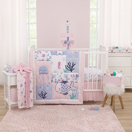 Come with me to the sea with this adorable nojo mermaid lagoon 4 piece crib bedding set. Includes a comforter, fitted crib sheet, crib skirt, and storage caddy. The comforter features various sea friends, jellyfish, starfish, seashells, and coral, with an allover sea friends printed back. Measuring 36" x 45", this comforter is perfect for tummy time. The fitted crib sheet is a playful assorted sea friends pattern in shades of pink, blue, aqua, white, and a touch of navy. Measures 28" x 52" and fits a standard size crib mattress. Features elastic edges for a safe and snug fit. The crib skirt is solid soft pink with a sheer gathered overlay and 14" drop length. The storage caddy measures 12" x 6" x 8"; corner toes make it reversible to an allover sea friends pattern or solid pink. All made w Sherpa Baby Blanket, Sea Nursery, Plush Baby Blankets, Mermaid Lagoon, Crib Skirt, Storage Caddy, Toddler Mattress, Crib Skirts, Nursery Bedding Sets