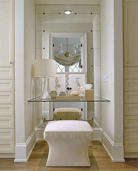 22 Small Dressing Area Ideas Bringing New Sensations into Interior Design Small Dressing Rooms, Floating Glass Shelves, Closet Vanity, Makeup Area, Mirrored Wall, Upholstered Stool, Dressing Area, Interiors Design, Table Chair