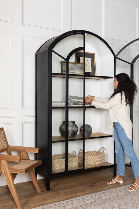 Mcgee And Co Black Cabinet, Black Cabinet In Living Room, How To Style Display Cabinet, Dining Room Cabinet Styling, Modern Display Cabinet Ideas, Black Tall Cabinet, Black Arched Cabinet Styling, Arch Cabinet Styling, Studio Mcgee Cabinet