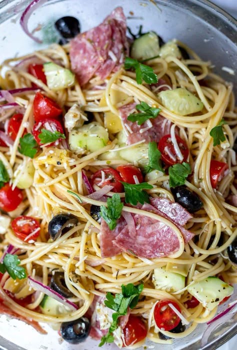 This Cold Spaghetti Salad Recipe is a fun pasta salad side dish for this summer. Filled with tomatoes, olives, artichokes, cucumbers, onion, salami and parmesan then tossed with a fresh, flavorful homemade Italian dressing. #pastasaladrecipes #spaghettisalad #pastasalad #sidedishrecipes Cold Pasta Recipes, Cold Spaghetti Salad, Spaghetti Pasta Salad, Fun Pasta, Pasta Side, Salad Cucumber, Spaghetti Salad, Cold Pasta Salad Recipes, Pasta Side Dishes