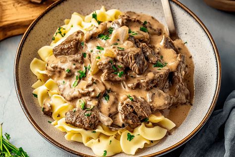 Creamy Beef Stroganoff Recipe, Creamy Beef Stroganoff, Beef Strips, Creamy Mushroom Sauce, Stroganoff Recipe, Tender Beef, Quick Weeknight Dinners, Mushroom Sauce, Beef Stroganoff