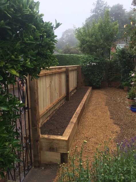 Raised Bed Garden Along Fence, Sleeper Raised Beds On A Slope, Raised Bed Border Ideas, Raised Garden Against Fence, Raised Bed Against Fence, Raised Bed Pathway, Garden Sleepers Borders, Raised Sleeper Beds, Sleeper Flower Beds