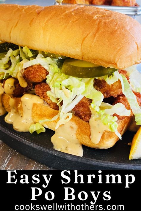 shrimp po boy on a plate Frozen Popcorn Shrimp Recipe, Shrimp Po Boys Recipe, Blackened Shrimp Poboy Sandwich, Easy Shrimp Poboy Sandwich, Shrimp Poor Boy Sandwich Recipes, Poor Boy Sandwich Recipes, Shrimp Po'boy Recipe, Shrimp Po Boy Sauce, Shrimp Poboy Sandwich