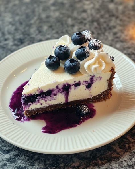 White Chocolate Blueberry Cheesecake 🍰 Prep Time: 20 minutes Cook Time: 1 hour Chill Time: 4 hours Total Time: 5 hours 20 minutes Servings: 10 Calories: 450 per slice Ingredients: 200g digestive biscuits 100g unsalted butter, melted 200g white chocolate, chopped 500g cream cheese 200g sour cream 150g sugar 3 large eggs 1 tsp vanilla extract 200g fresh blueberries Blueberry compote for topping (optional) Instructions: 1. Prep the Crust Crush the digestive biscuits into fine crumbs. Mix in th... Blueberry Cream Cheese Dessert, White Chocolate Blueberry Cheesecake, Chocolate Blueberry Cheesecake, Chocolate Blueberry, Cream Cheese Desserts, Blueberry Compote, Blueberry Cream Cheese, Chill Time, Digestive Biscuits